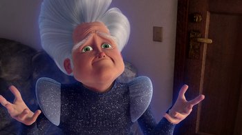Movie still from “Megamind” (2010), directed by Tom McGrath – An old woman with a white hair and a blue shirt; Close Up shot, Low angle