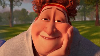 Movie still from “Megamind” (2010), directed by Tom McGrath – An animated person with a red hair headband is smiling; Extreme Close Up shot, Over the shoulder angle