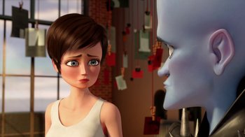 Movie still from “Megamind” (2010), directed by Tom McGrath – An animated scene of a boy and a blue robot face to face; Close Up shot, Over the shoulder angle