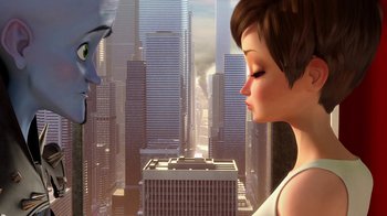 Movie still from “Megamind” (2010), directed by Tom McGrath – A woman and a man looking at each other in a city; Close Up shot, Over the shoulder angle