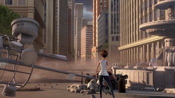 Movie still from “Megamind” (2010), directed by Tom McGrath – An animated scene of a woman standing in the middle of a city; Wide shot, Over the shoulder angle