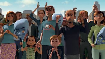 Movie still from “Megamind” (2010), directed by Tom McGrath – A group of people standing next to each other in front of buildings; Medium shot, Low angle