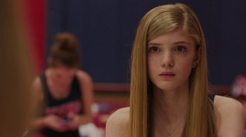 Movie still from “Men, Women & Children” (2014), directed by Jason Reitman – A girl with long blonde hair sitting in front of another girl; Close Up shot, Over the shoulder angle