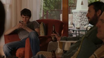 Movie still from “Men, Women & Children” (2014), directed by Jason Reitman – Two men sitting in a living room drinking beer; Medium shot, Over the shoulder angle