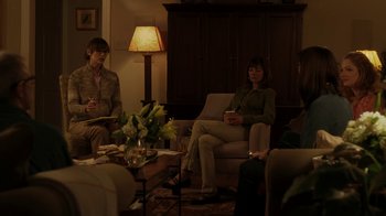 Movie still from “Men, Women & Children” (2014), directed by Jason Reitman – A group of people sitting around a living room; Medium shot, Over the shoulder angle