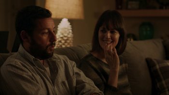 Movie still from “Men, Women & Children” (2014), directed by Jason Reitman – A man and a woman sitting on a couch in a living room; Close Up shot, Over the shoulder angle