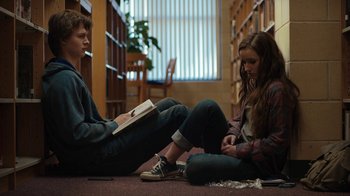 Movie still from “Men, Women & Children” (2014), directed by Jason Reitman – Two people sitting on the floor in a library; Medium shot, Low angle