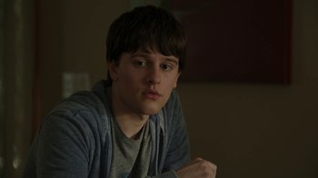 Movie still from “Men, Women & Children” (2014), directed by Jason Reitman – A young man sitting in front of a window; Close Up shot, Low angle