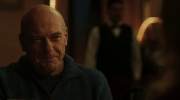 Movie still from “Men, Women & Children” (2014), directed by Jason Reitman – A bald man in a blue jacket is looking at the camera; Close Up shot, Over the shoulder angle