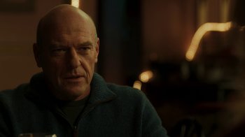 Movie still from “Men, Women & Children” (2014), directed by Jason Reitman – A man with a bald head is sitting in a room; Close Up shot, Over the shoulder angle