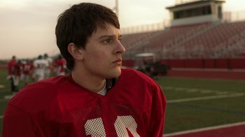 Movie still from “Men, Women & Children” (2014), directed by Jason Reitman – A young man in a red football uniform; Close Up shot, Low angle