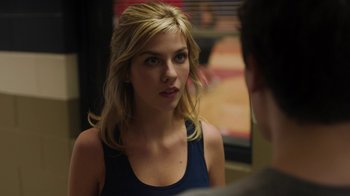 Movie still from “Men, Women & Children” (2014), directed by Jason Reitman – A beautiful young woman looking at a man in the mirror; Close Up shot, Over the shoulder angle