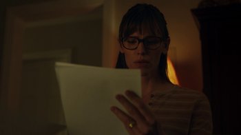 Movie still from “Men, Women & Children” (2014), directed by Jason Reitman – A woman wearing glasses looking at a sheet of paper; Close Up shot, Low angle