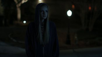 Movie still from “Men, Women & Children” (2014), directed by Jason Reitman – A woman in a hoodie standing in the dark at night; Medium shot, Over the shoulder angle