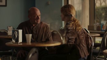 Movie still from “Men, Women & Children” (2014), directed by Jason Reitman – A man and a woman sitting at a table talking to each other; Medium shot, Over the shoulder angle