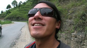 Movie still from “Meru” (2015), directed by Jimmy Chin – A person wearing sunglasses near a road; Close Up shot, Low angle