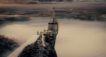 Movie still from “Mirror Mirror” (2012), directed by Tarsem Singh – An aerial view of a castle on top of a mountain; Extreme Wide shot, High angle