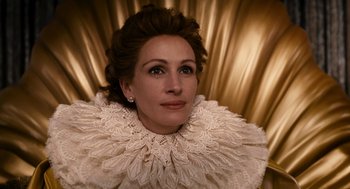 Movie still from “Mirror Mirror” (2012), directed by Tarsem Singh – A person wearing a dress; Close Up shot, Overhead angle