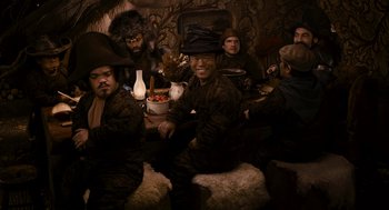 Movie still from “Mirror Mirror” (2012), directed by Tarsem Singh – A group of men sitting around a table; Medium shot, High angle