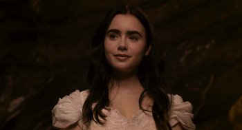 Movie still from “Mirror Mirror” (2012), directed by Tarsem Singh – A woman in a white dress with long black hair; Close Up shot, Low angle