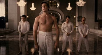 Movie still from “Mirror Mirror” (2012), directed by Tarsem Singh – A group of men standing around a room; Medium shot, Low angle