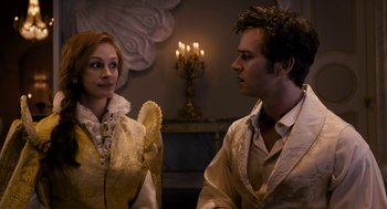 Movie still from “Mirror Mirror” (2012), directed by Tarsem Singh – A man and a woman are looking at each other; Medium shot, Over the shoulder angle