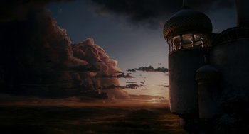 Movie still from “Mirror Mirror” (2012), directed by Tarsem Singh – A view of a sunset with a sky filled with dark clouds; Extreme Wide shot, Low angle
