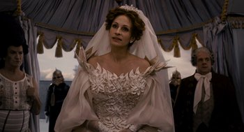 Movie still from “Mirror Mirror” (2012), directed by Tarsem Singh – A woman wearing a wedding dress and veil; Medium shot, Over the shoulder angle