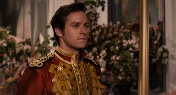 Movie still from “Mirror Mirror” (2012), directed by Tarsem Singh – A man in a red and gold military uniform; Close Up shot, Over the shoulder angle