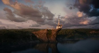 Movie still from “Mirror Mirror” (2012), directed by Tarsem Singh – A view of a lake with a castle on top of a cliff; Extreme Wide shot, Low angle