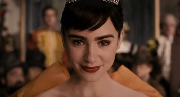 Movie still from “Mirror Mirror” (2012), directed by Tarsem Singh – A person wearing a tiara; Close Up shot, Over the shoulder angle