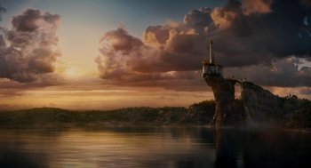 Movie still from “Mirror Mirror” (2012), directed by Tarsem Singh – A lighthouse sitting on top of an island in the middle of the ocean; Extreme Wide shot, Low angle