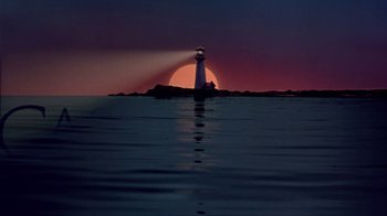 Movie still from “Miss Congeniality” (2000), directed by Donald Petrie – A light house on the water at sunset; Extreme Wide shot, Low angle