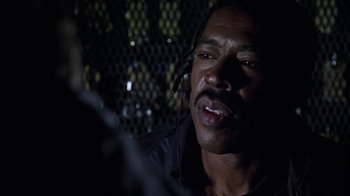 Movie still from “Miss Congeniality” (2000), directed by Donald Petrie – A person wearing headphones; Close Up shot, Over the shoulder angle