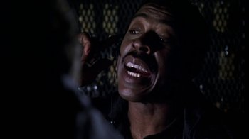 Movie still from “Miss Congeniality” (2000), directed by Donald Petrie – A person talking on a cell phone; Close Up shot, Low angle