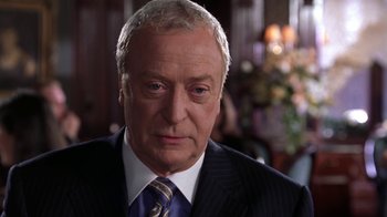Movie still from “Miss Congeniality” (2000), directed by Donald Petrie – An older man wearing a suit and tie; Close Up shot, Over the shoulder angle