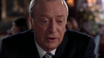 Movie still from “Miss Congeniality” (2000), directed by Donald Petrie – An older man wearing a suit and tie; Close Up shot, Over the shoulder angle