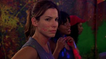 Movie still from “Miss Congeniality” (2000), directed by Donald Petrie – A group of women standing next to each other in a room; Close Up shot, Over the shoulder angle
