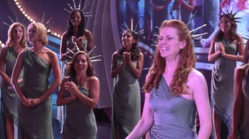 Movie still from “Miss Congeniality” (2000), directed by Donald Petrie – A group of women standing next to each other on a stage; Medium shot, Low angle