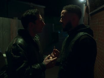 A couple of men standing next to each other