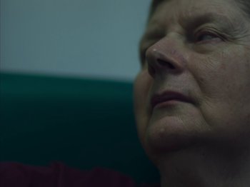 An older woman looking up into the sky