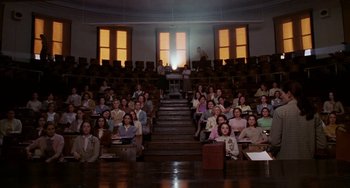 Movie still from “Mona Lisa Smile” (2003), directed by Mike Newell – A large group of people sitting in a room; Extreme Wide shot, High angle