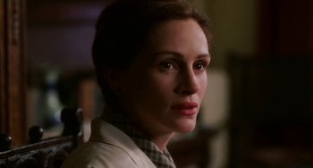 Movie still from “Mona Lisa Smile” (2003), directed by Mike Newell – A person wearing a jacket; Close Up shot, Over the shoulder angle