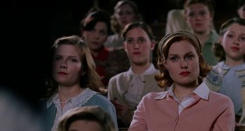 Movie still from “Mona Lisa Smile” (2003), directed by Mike Newell – A group of women sitting in a row in front of each other; Close Up shot, High angle