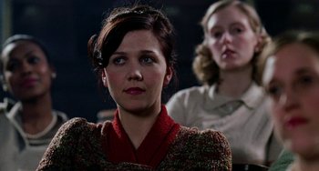 Movie still from “Mona Lisa Smile” (2003), directed by Mike Newell – A woman in a red sweater and a woman in a brown sweater; Close Up shot, Over the shoulder angle