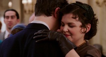 Movie still from “Mona Lisa Smile” (2003), directed by Mike Newell – A man and a woman embracing each other in front of a mirror; Close Up shot, Over the shoulder angle