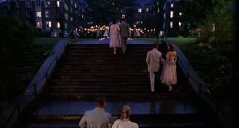 Movie still from “Mona Lisa Smile” (2003), directed by Mike Newell – A group of people walking down a set of stairs; Wide shot, High angle