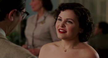 Movie still from “Mona Lisa Smile” (2003), directed by Mike Newell – A beautiful woman with red lipstick sitting next to another woman; Close Up shot, Over the shoulder angle