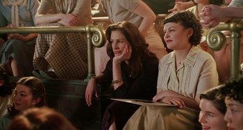 Movie still from “Mona Lisa Smile” (2003), directed by Mike Newell – Two women sitting next to each other on a bench; Medium shot, High angle