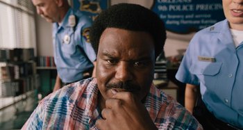 Movie still from “Mona Lisa and the Blood Moon” (2021), directed by Ana Lily Amirpour – An african american man with a serious look on his face; Close Up shot, Over the shoulder angle